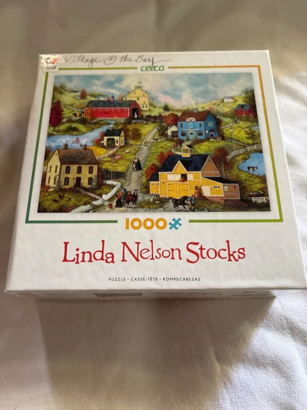 Linda Nelson Stocks Village At The Bay 1000-Piece Jigsaw Puzzle By Ceaco